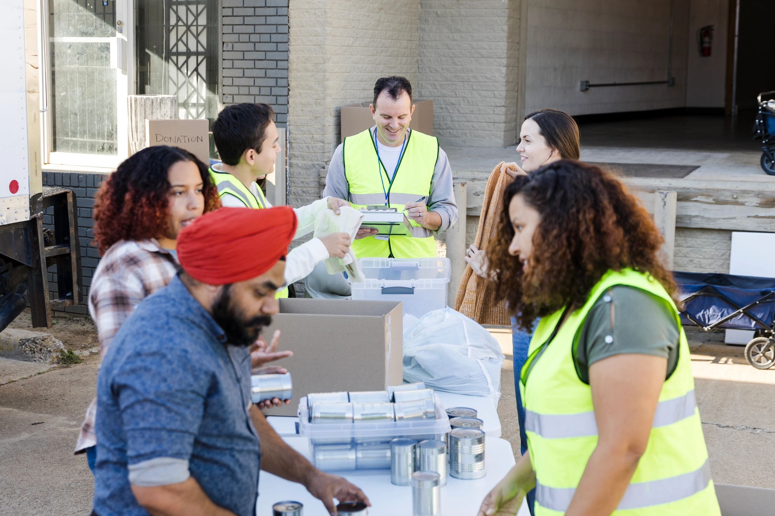 Volunteers organizing donated food and supplies